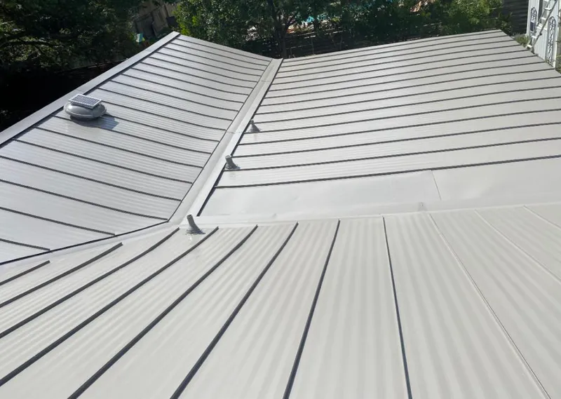 Solar attic fan installed on a metal roof for Roof Ventilation in Pleasant Prairie